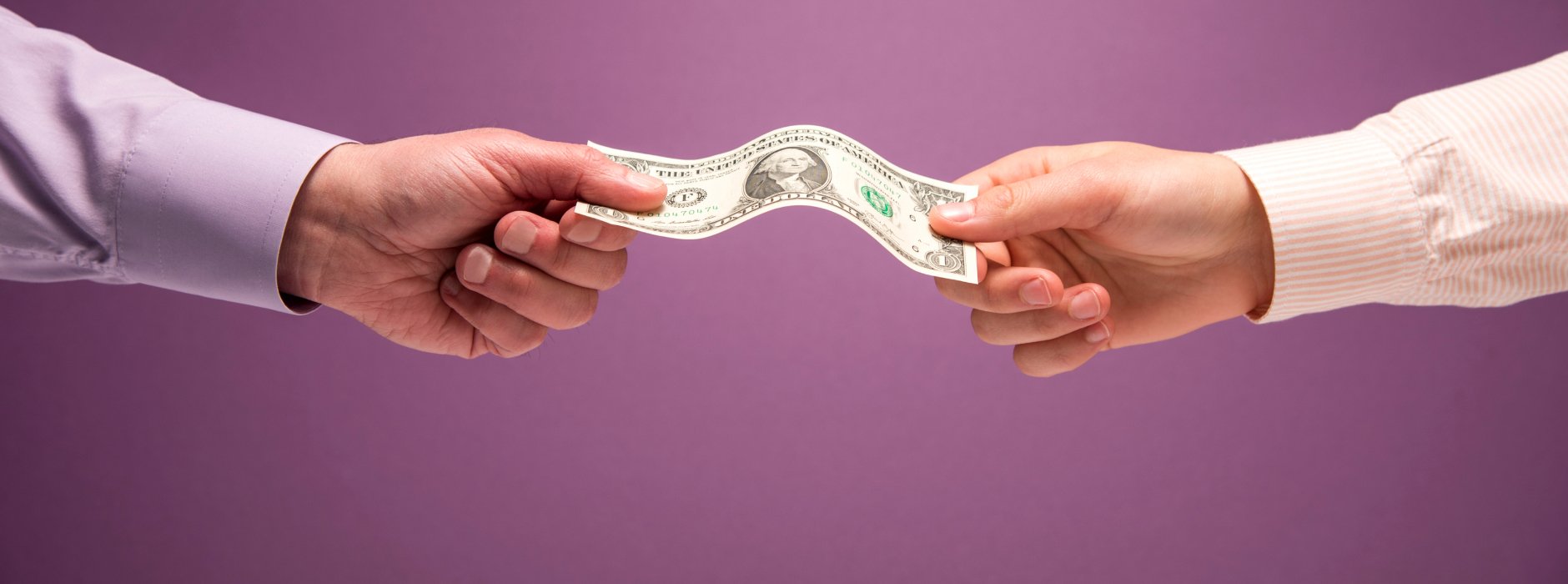 two people handing each other money
