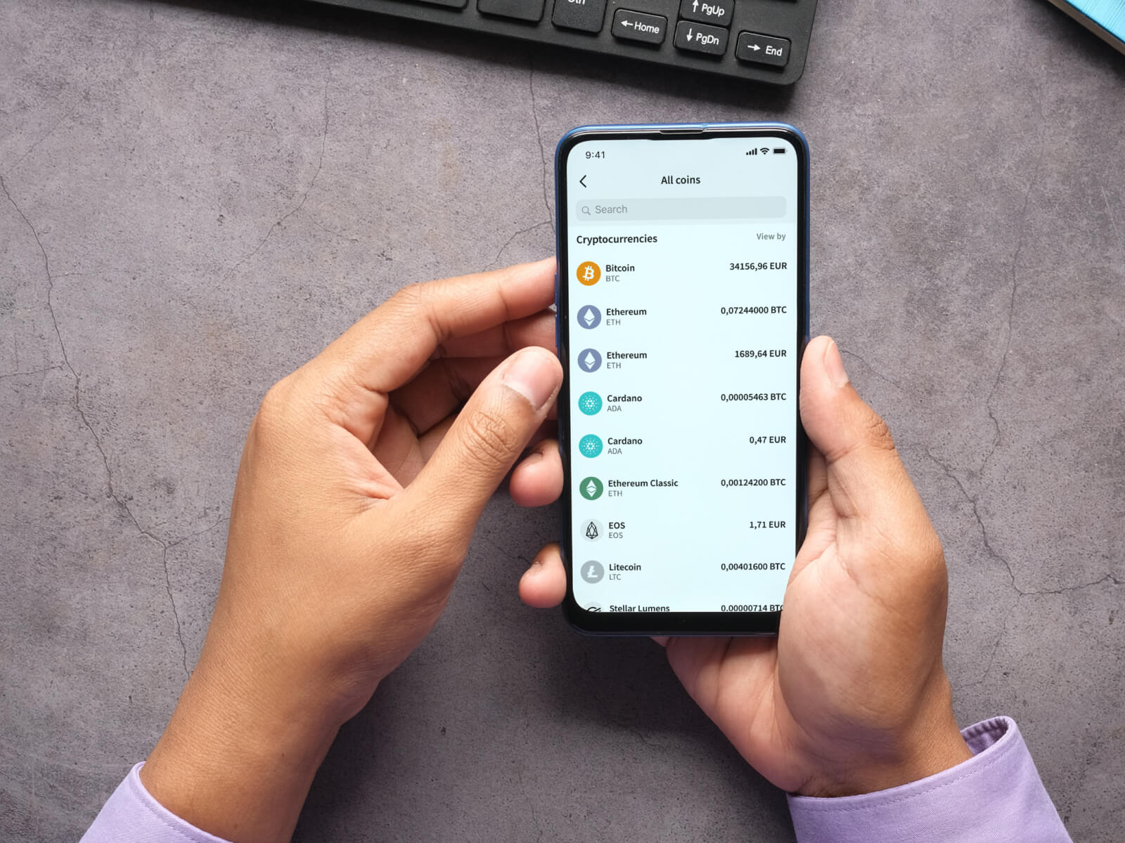Person checking the Skrill mobile app for all available cryptocurrencies