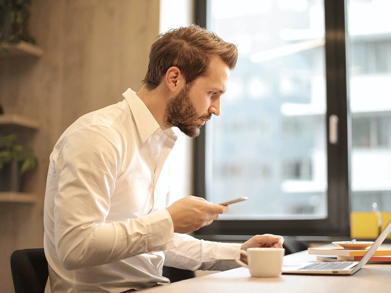 man in white shirt working