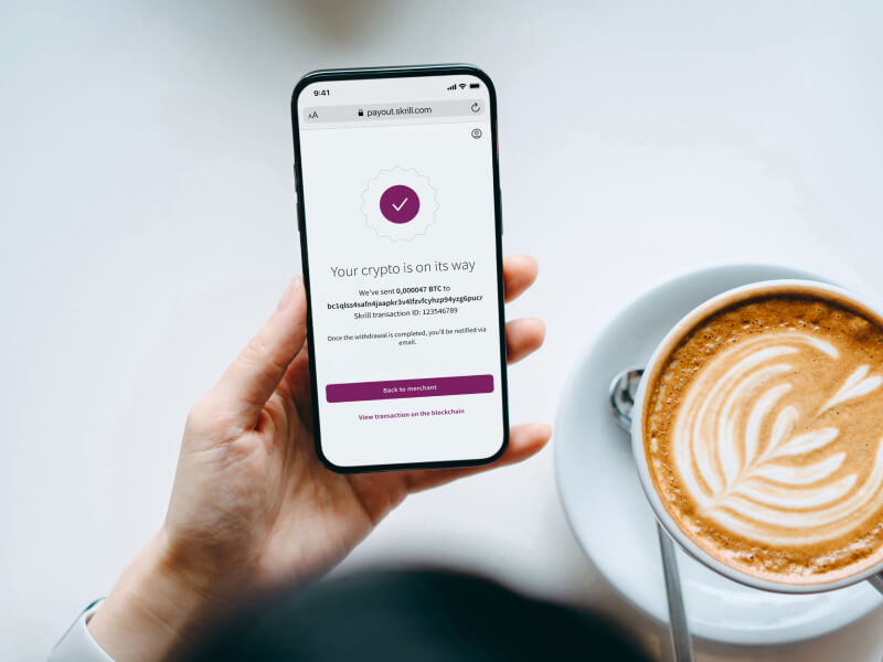 phone showing successful crypto transaction on Skrill