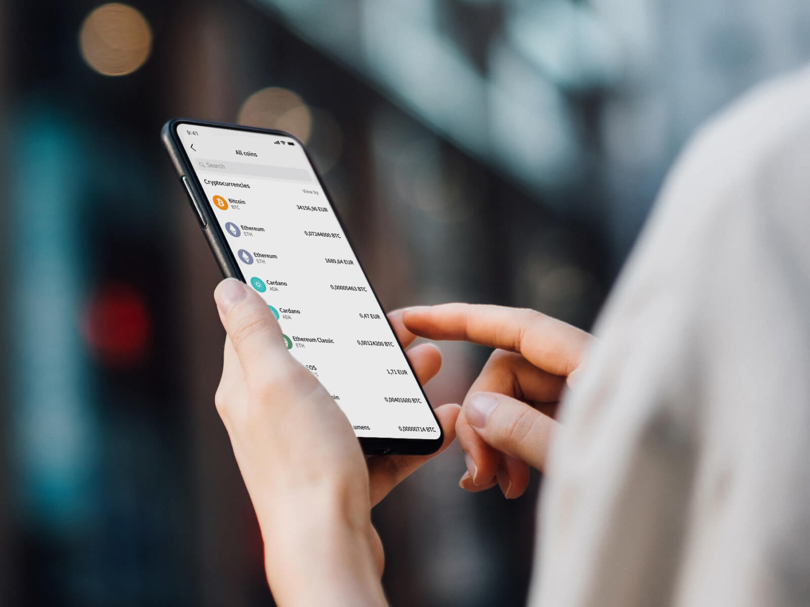 Person checking the Skrill mobile app for all available cryptocurrencies