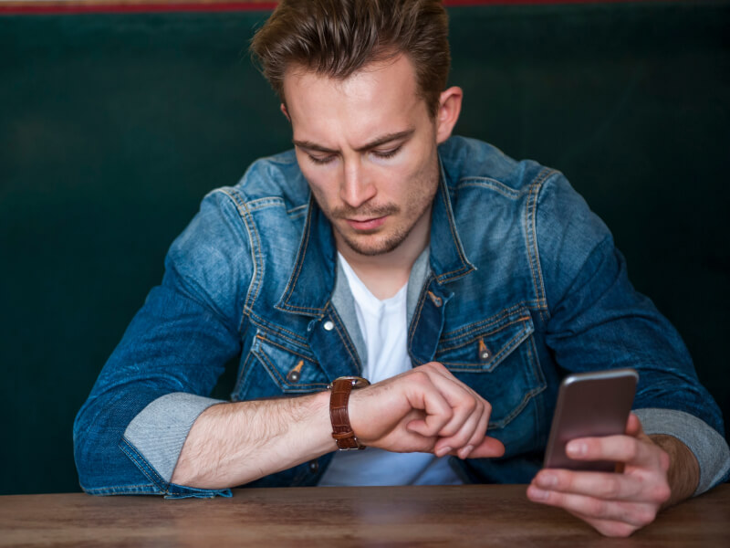man looking at his watch