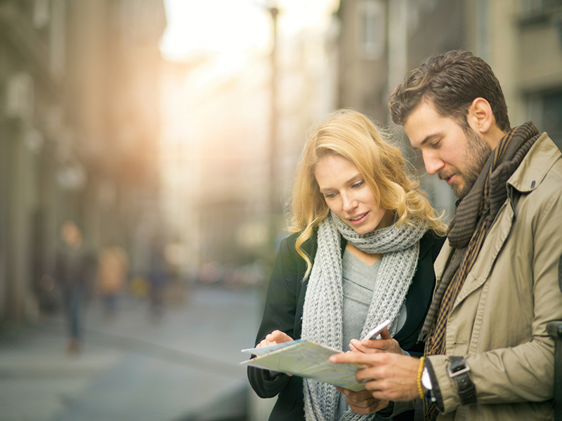 man and woman looking at a map