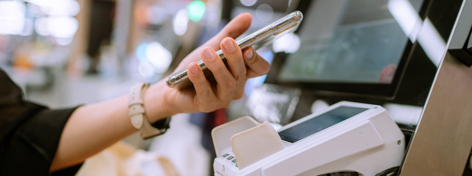 Woman paying via contactless