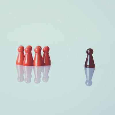 one pawn with different color separated from the rest