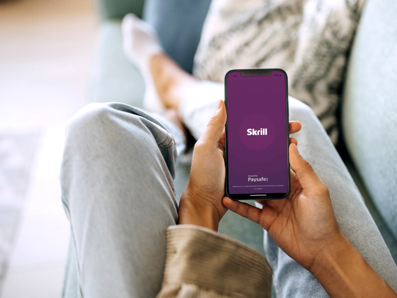person opening the Skrill mobile app