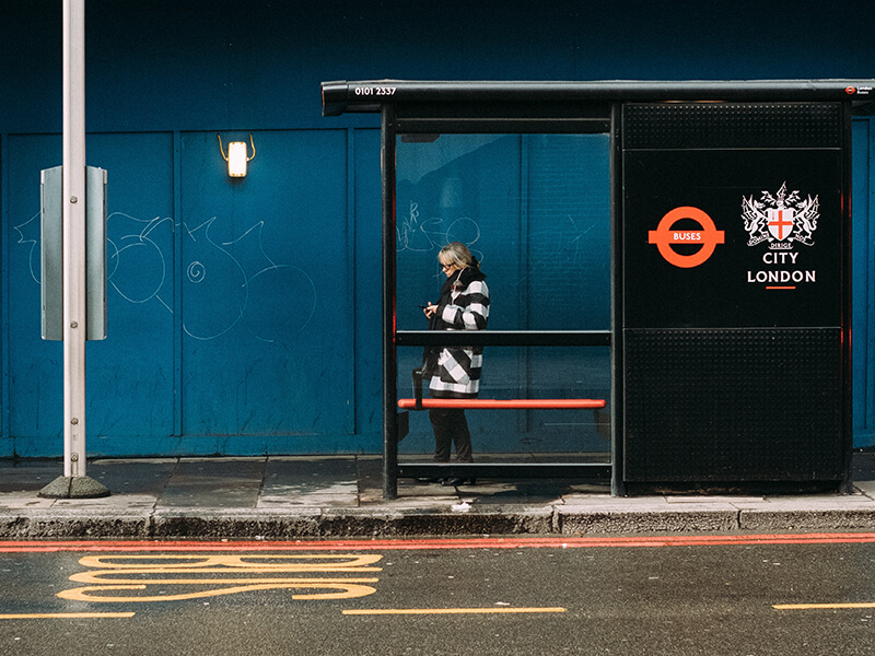 woman waiting at the bus stop