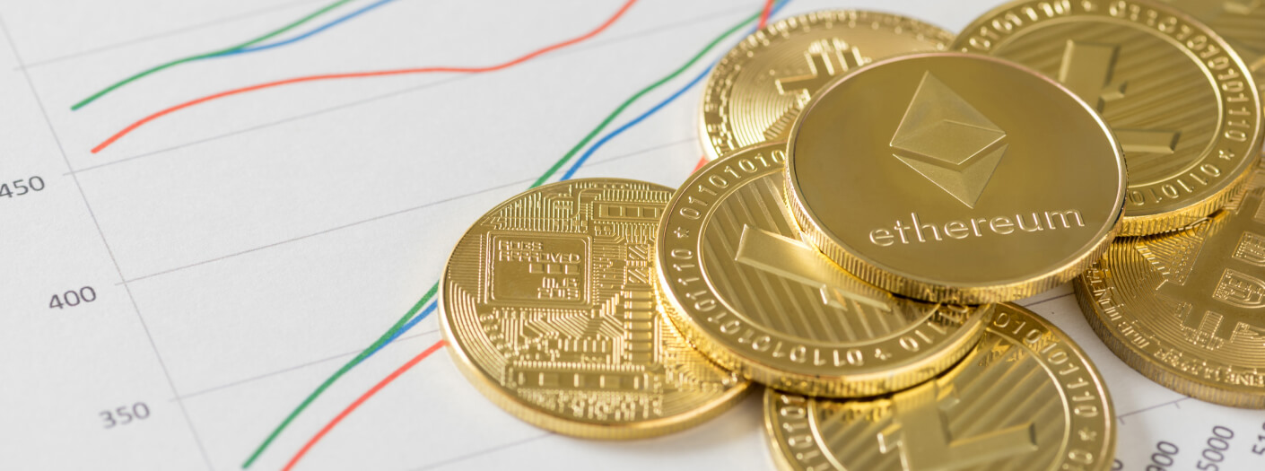 different cryptocurrencies laying on a piece of paper