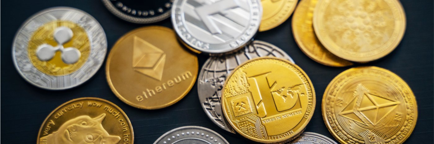various crypto coins on a black background
