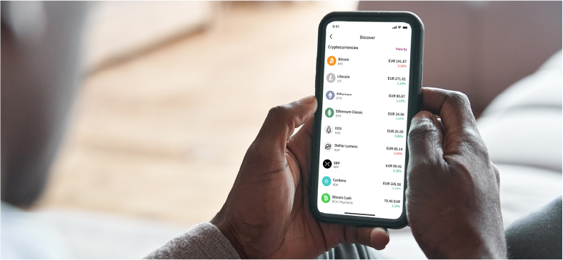 man looking at a screen with crypto list in the Skrill wallet