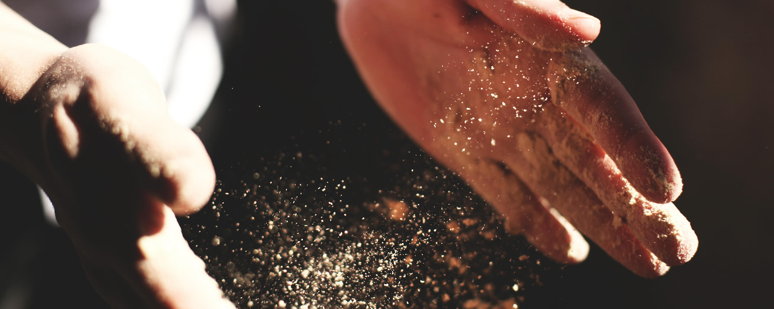 hands clapping with dust in between