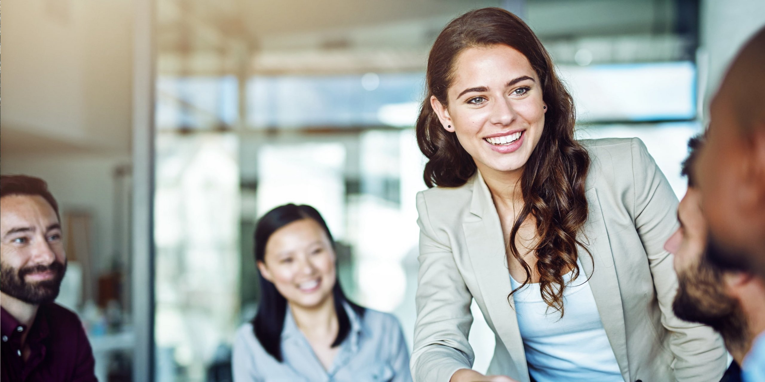 Skrill - merchants we work with; smiling group of people in an office