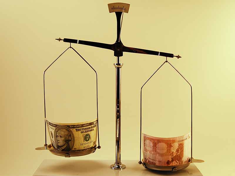 two banknotes on scales