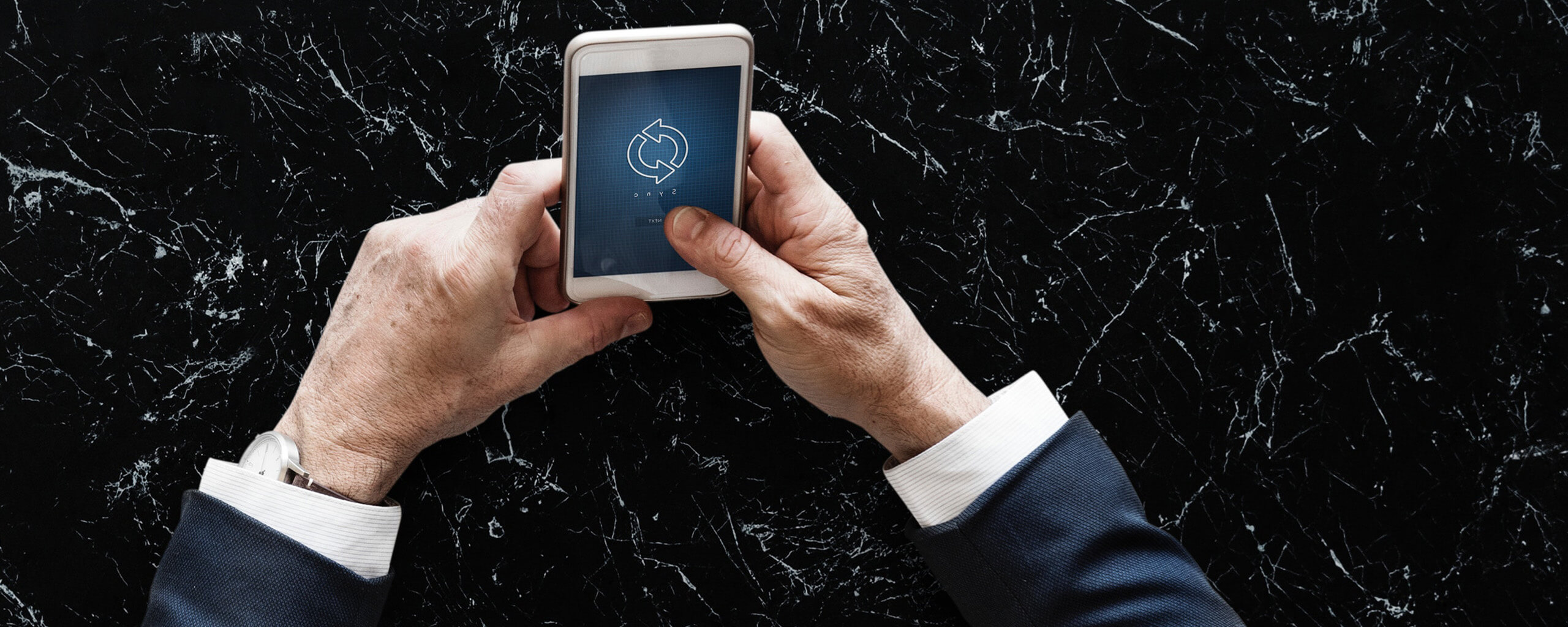 a man transferring crypto via phone app