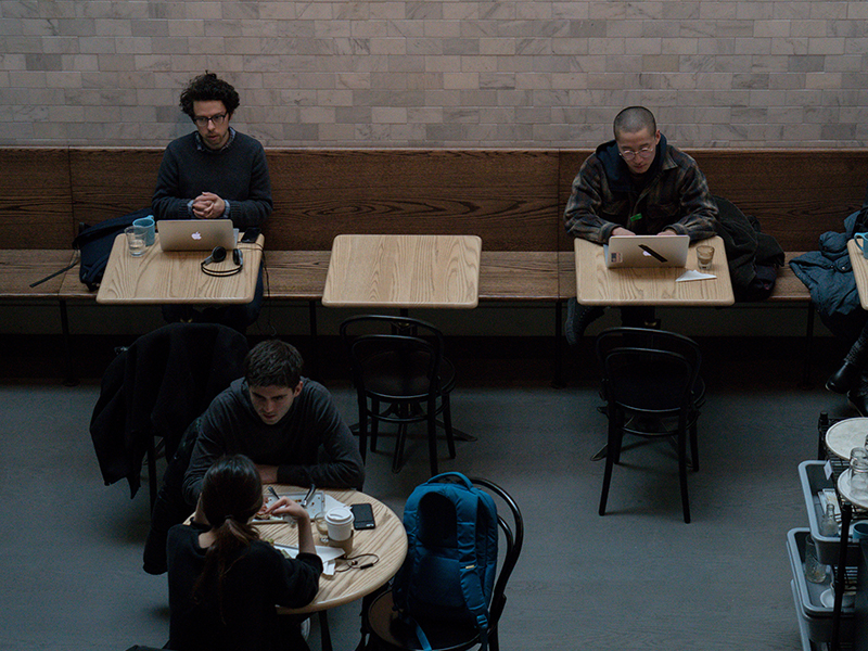 people working in a cafe