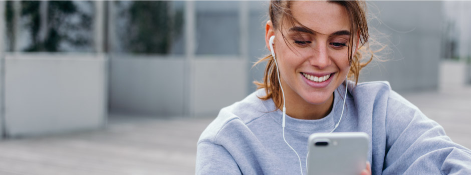 girl with phone and earphones