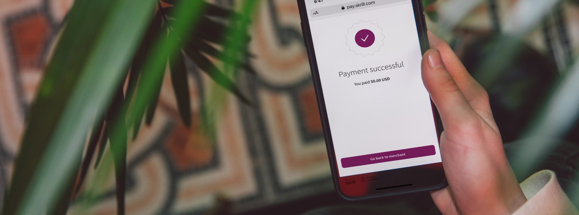 phone in hand showing payment successful
