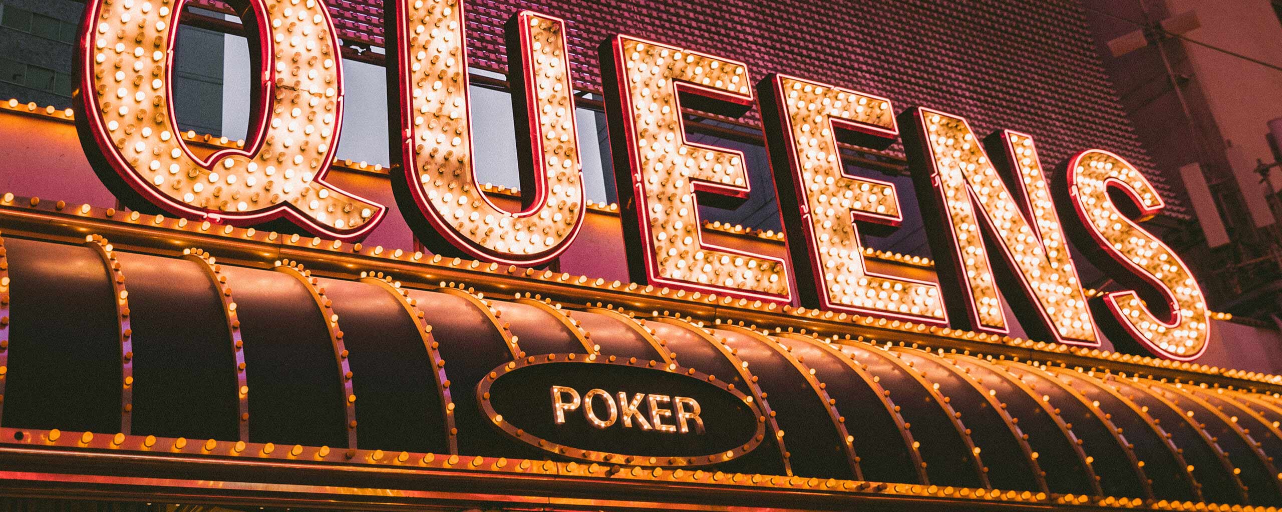 Queens poker plate on a roof