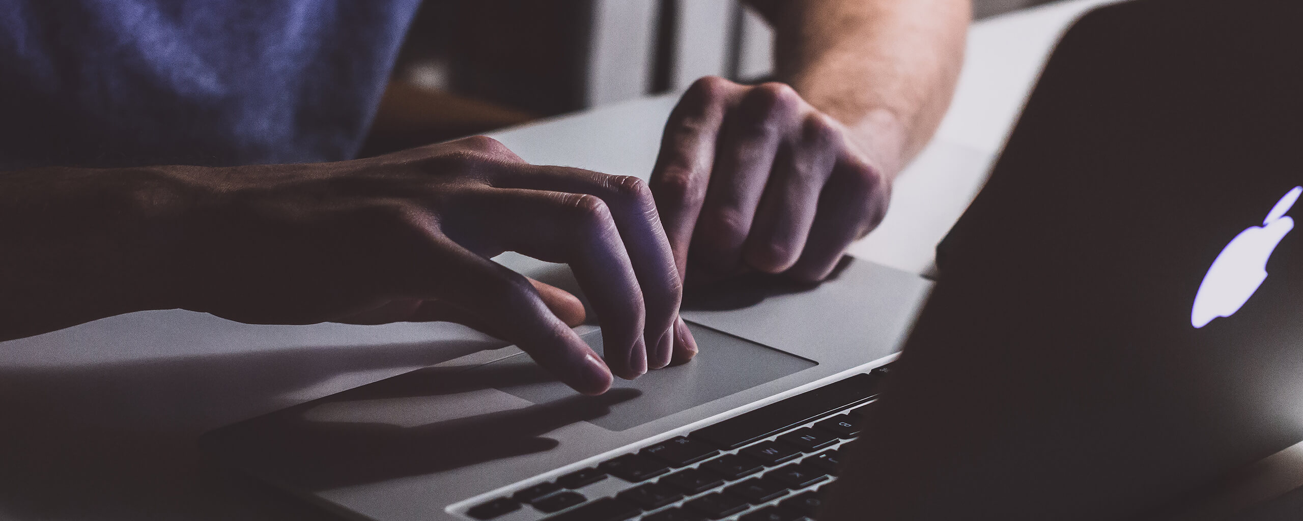 man browsing on a laptop