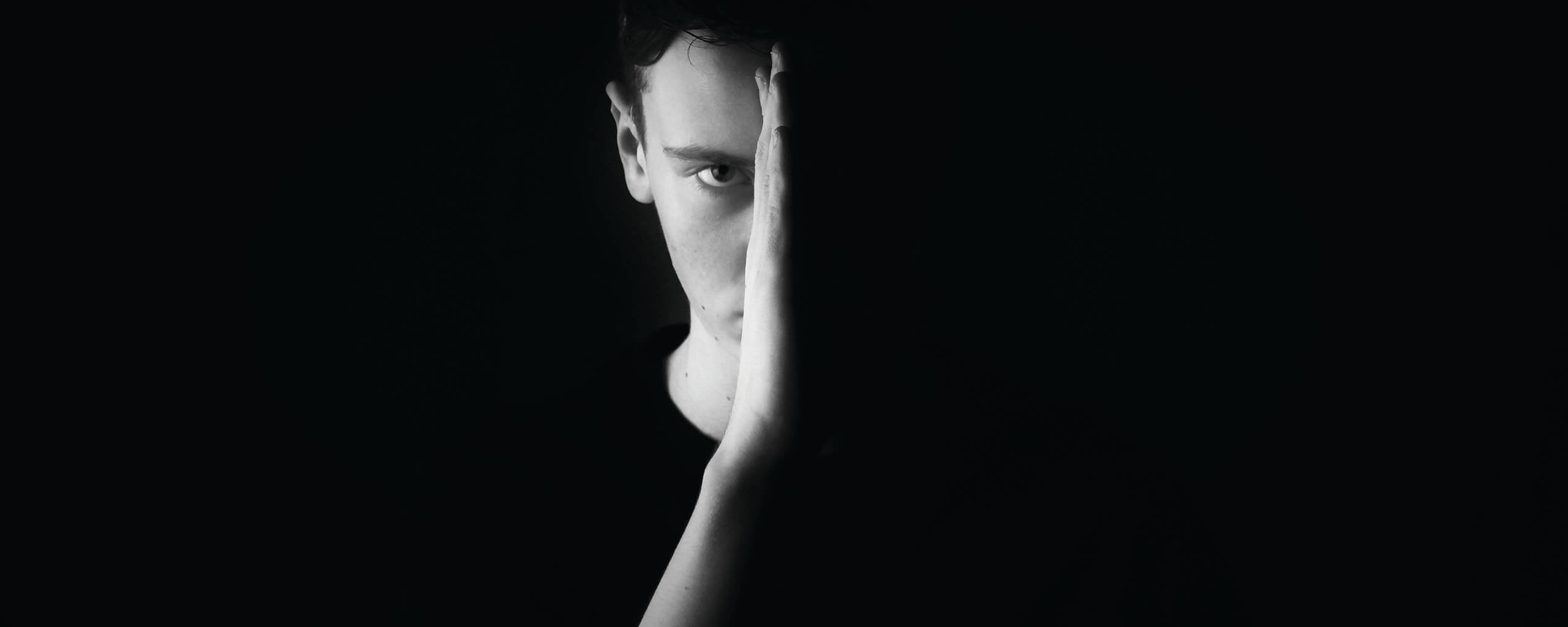 concentrated man on a dark background