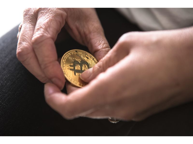 Hands holding Bitcoin