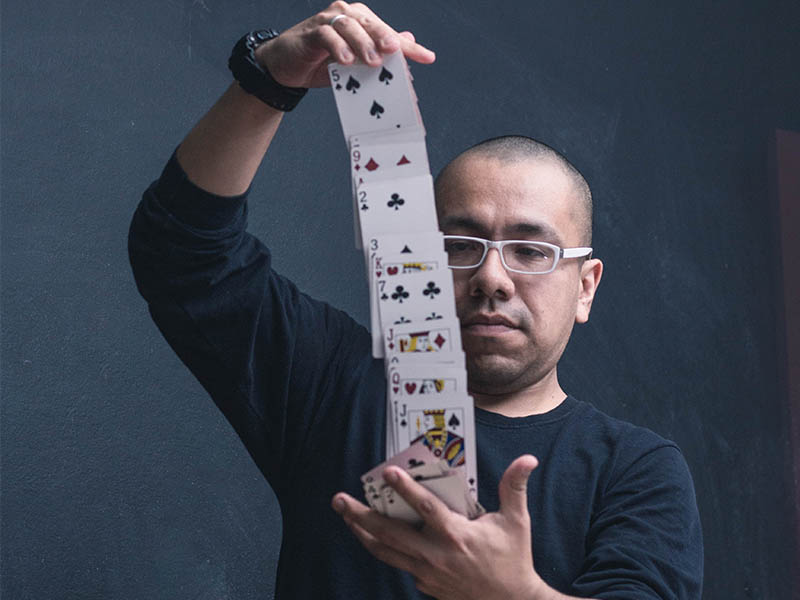 man holding a deck of cards