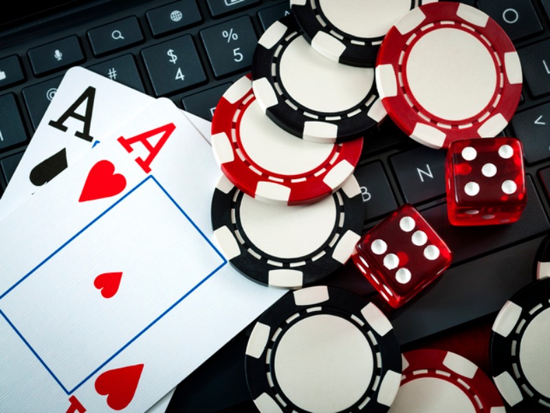 Chips, dice and cards over a keyboard