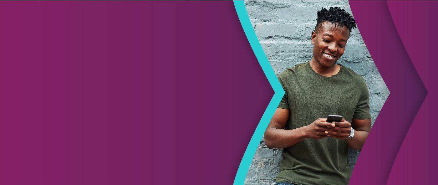 man smiling at his phone, using Skrill digital wallet