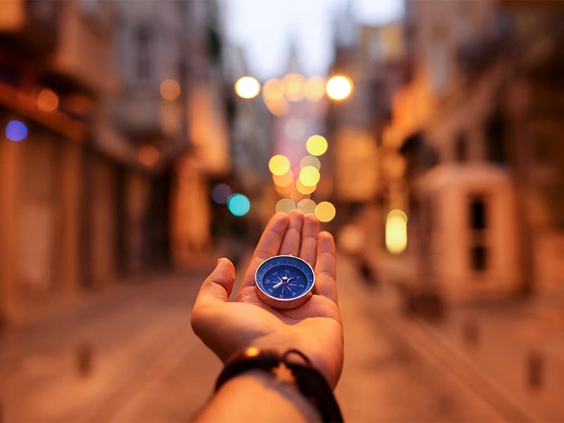 hand with a compass