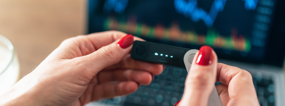women holding pendrive with laptop in background
